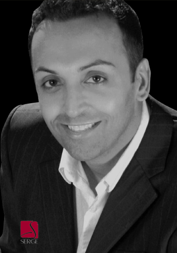 Realtor portrait in black-and-white with direct eye contact and friendly smile